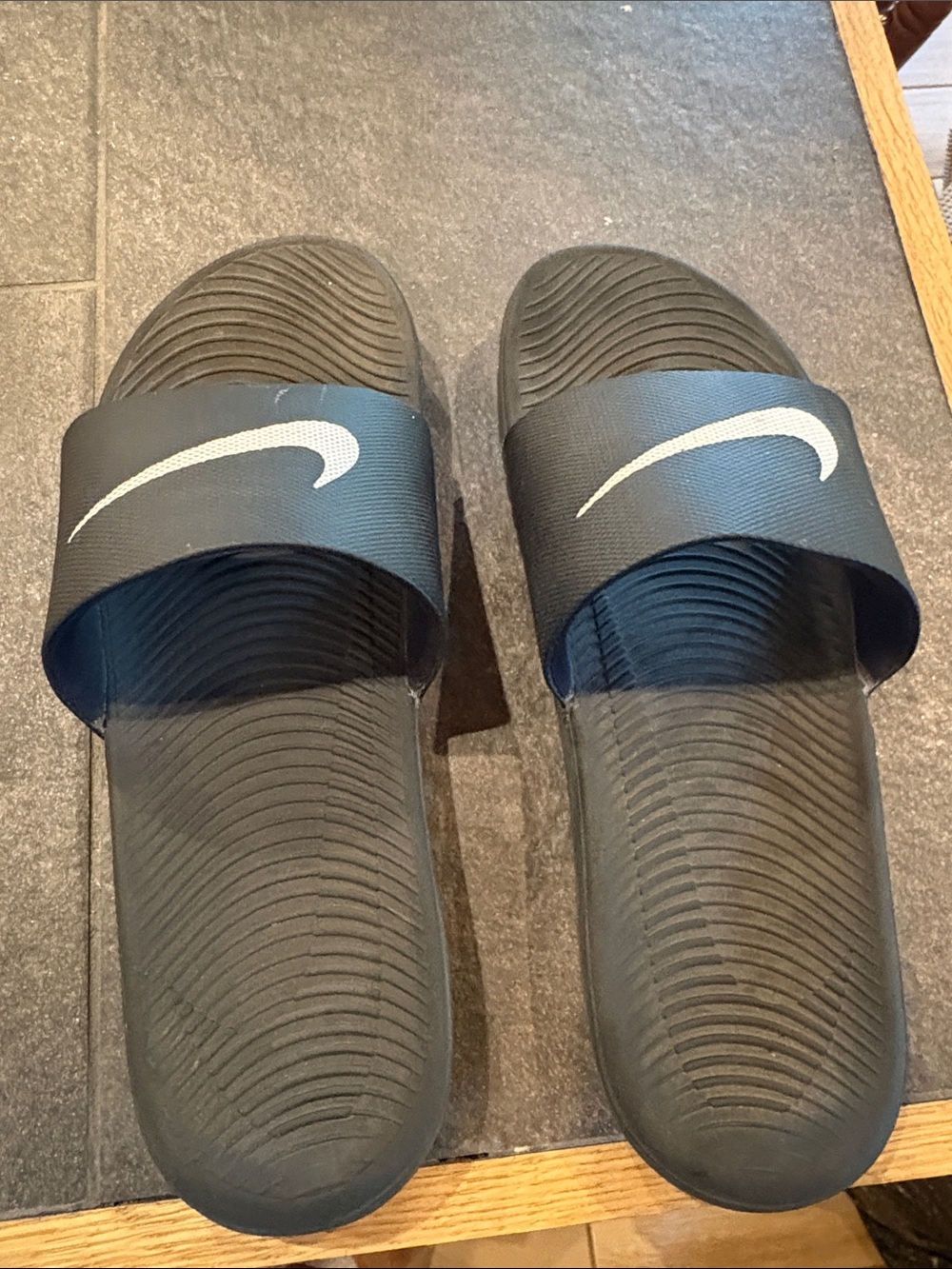 Nike Black Slides with White Swoosh Logo